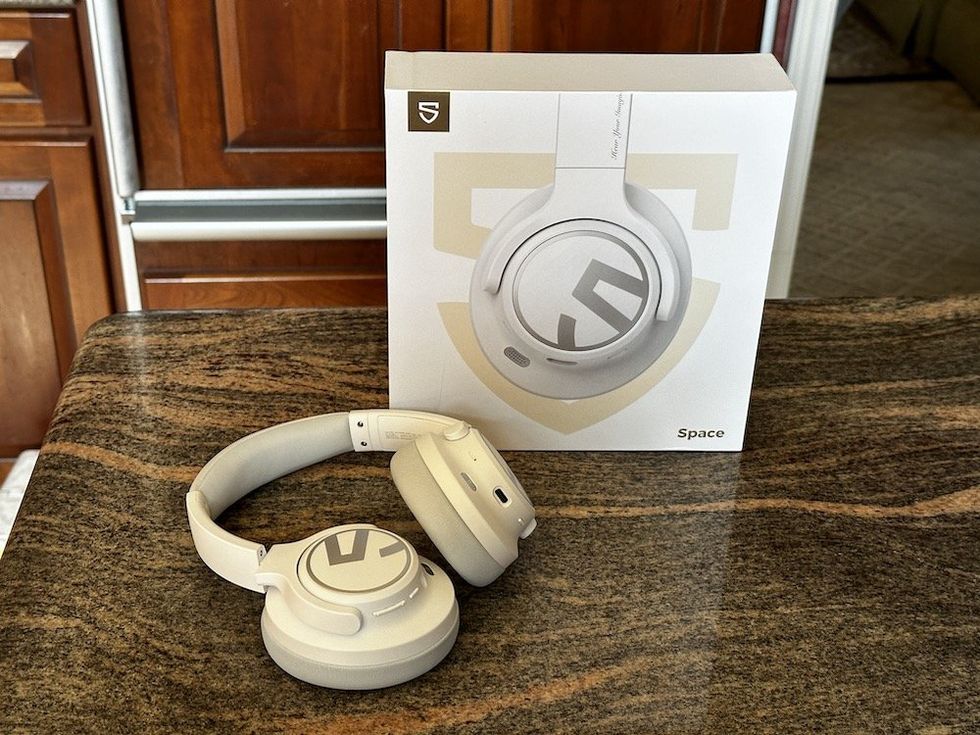 a photo of SoundPEATS wireless headphones and box on a countertop
