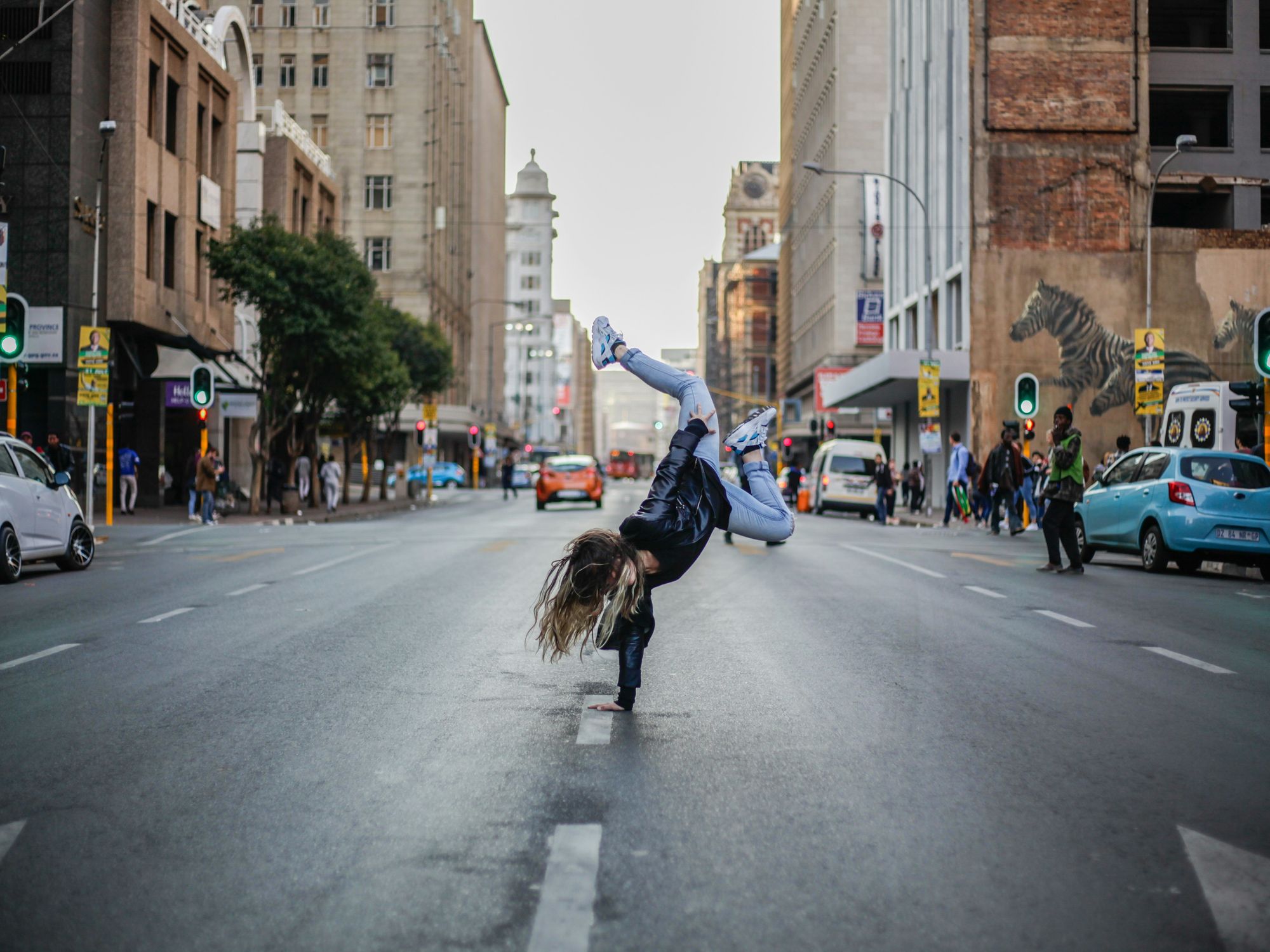 woman dancing on concrete road