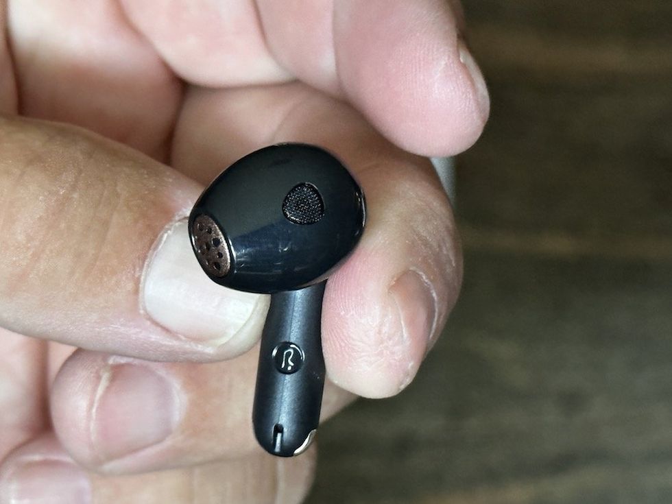 another close up of the SoundPEATS Air4 Wireless Earbud in the hand of the reviewer
