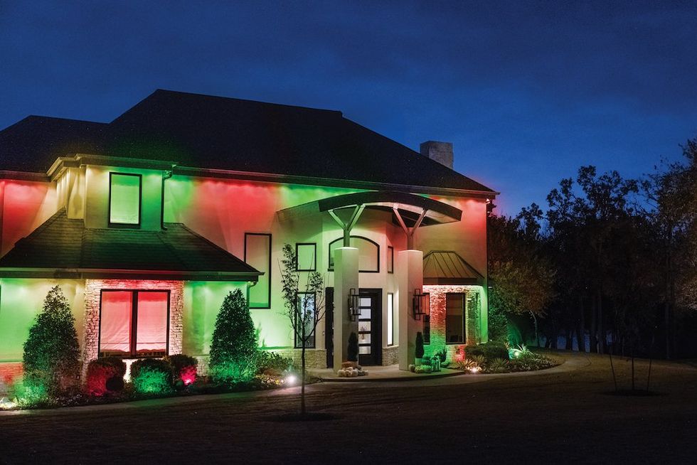 a. photo of a house with Jasco's Eternity Lights at night.