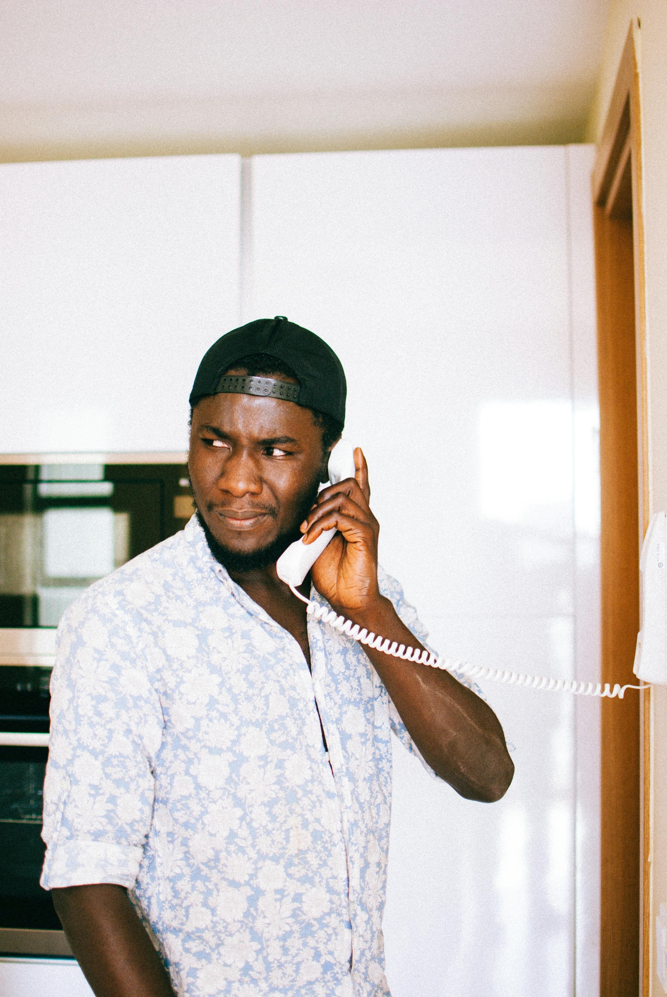 man on a landline phone