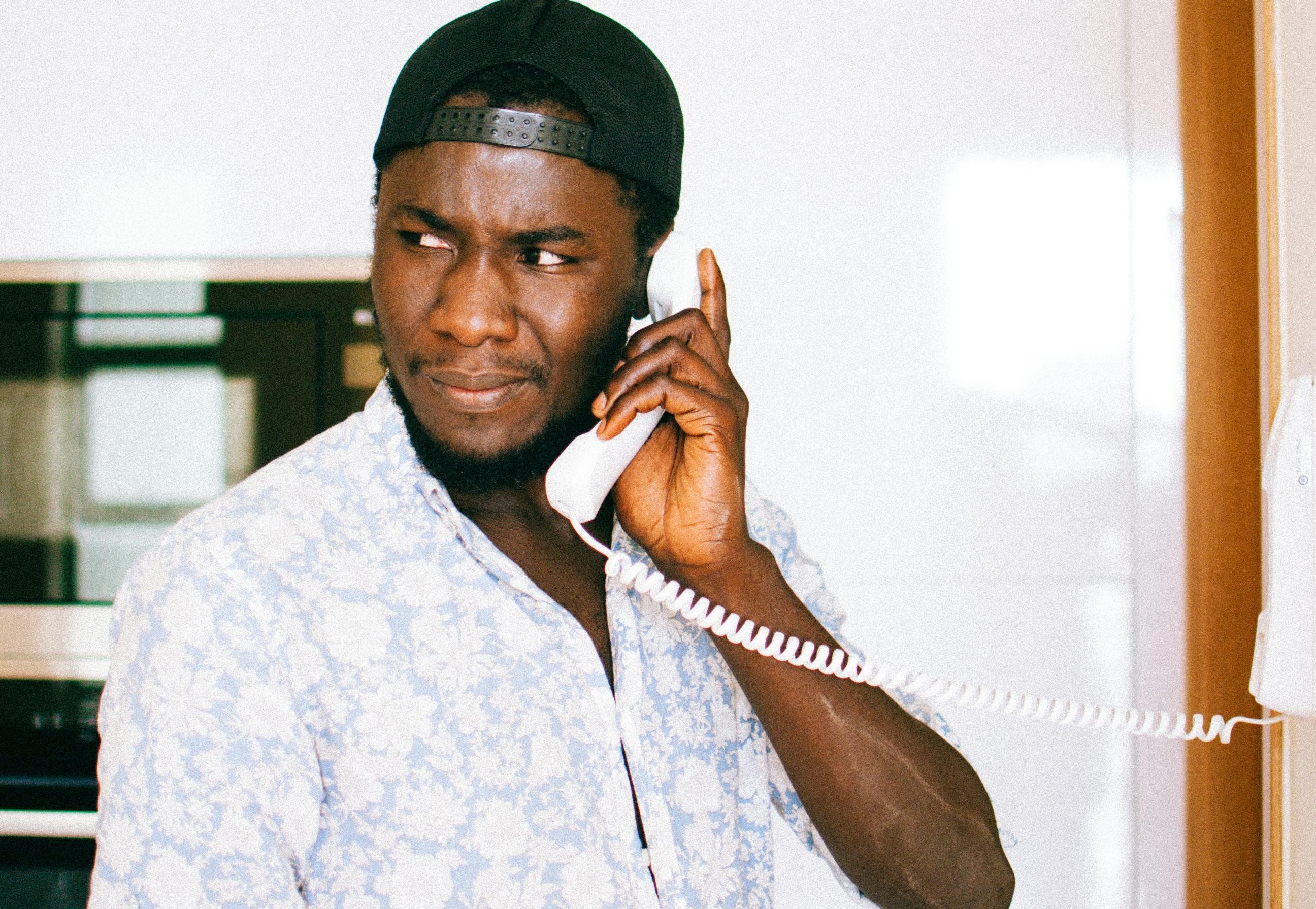 man on a landline phone