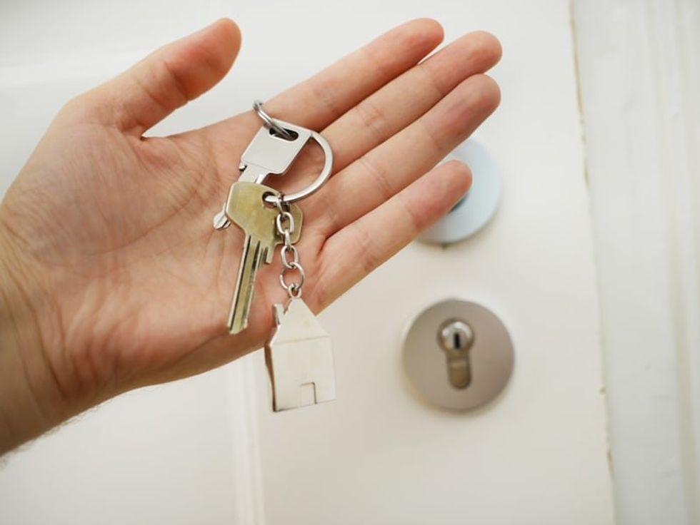 someone holding housekeys