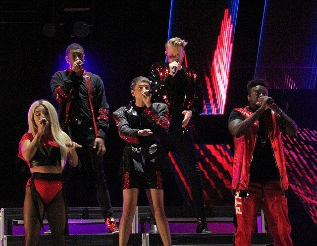Pentatonix singers on stage