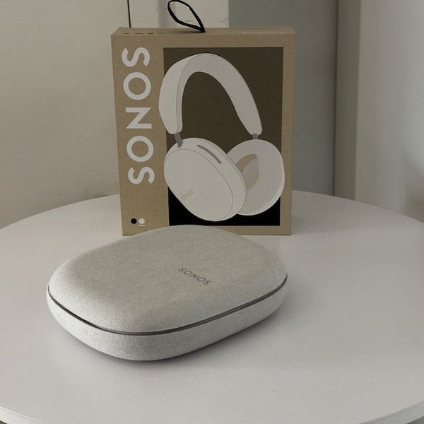 a photo of Sonos Ace Wireless Headphones in white with box on a table