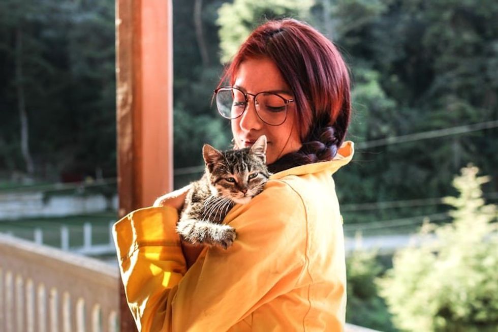 woman holding a cat