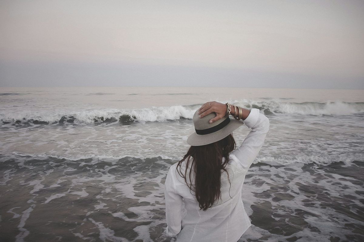 woman looking out at the ocean