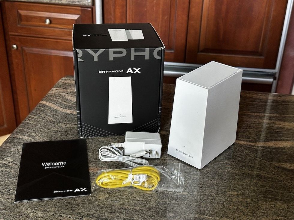 A photo of Gryphon AX Router unboxed on a counter