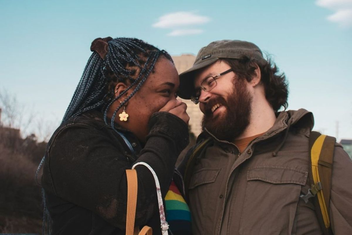 interracial couple smiling and laughing together