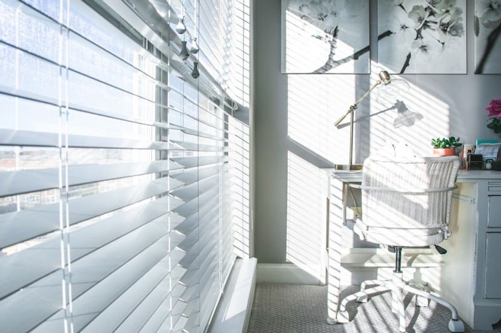 u200bWhite blinds on a window