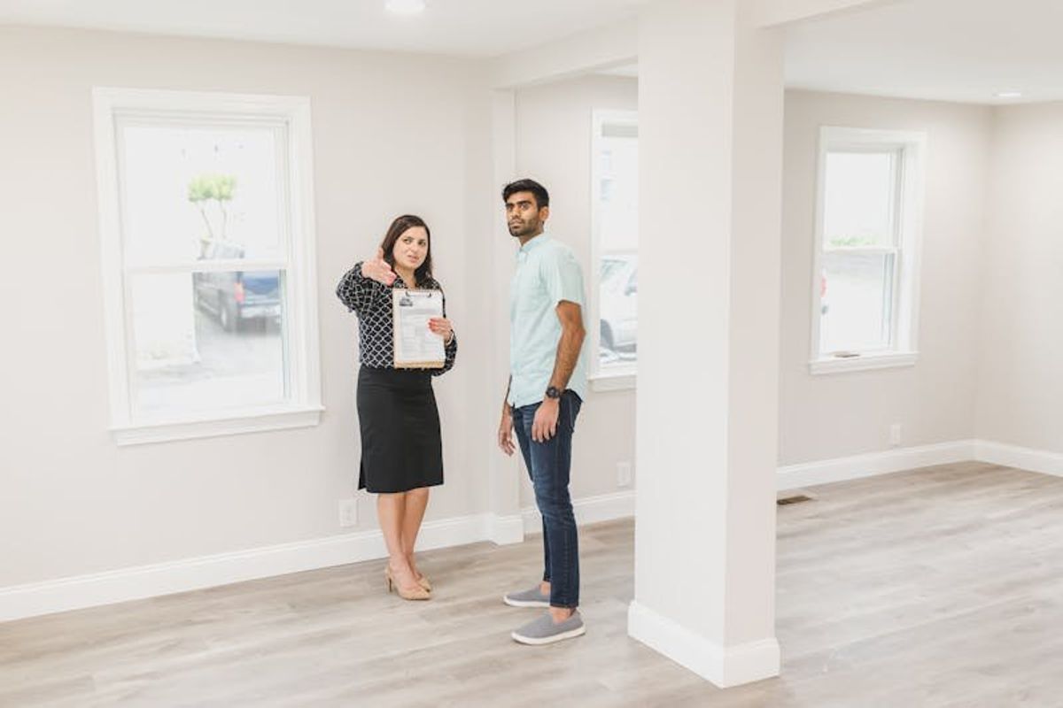 real estate agent showing a house