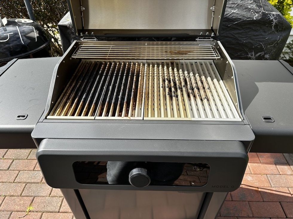 a photo of Current Model G grill after smartclean mode.  It shows the grates are still brown from cooking.