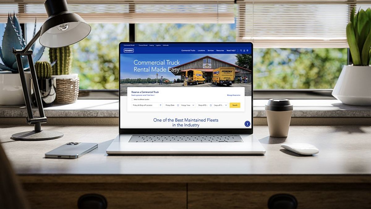 Newly revamped commercial truck rental site showcased on a laptop computer overlooking a green landscape.