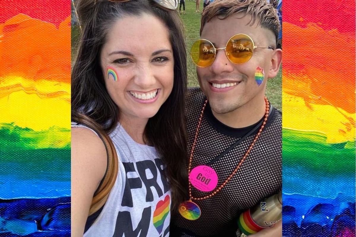 Two people smiling together wearing Pride gear