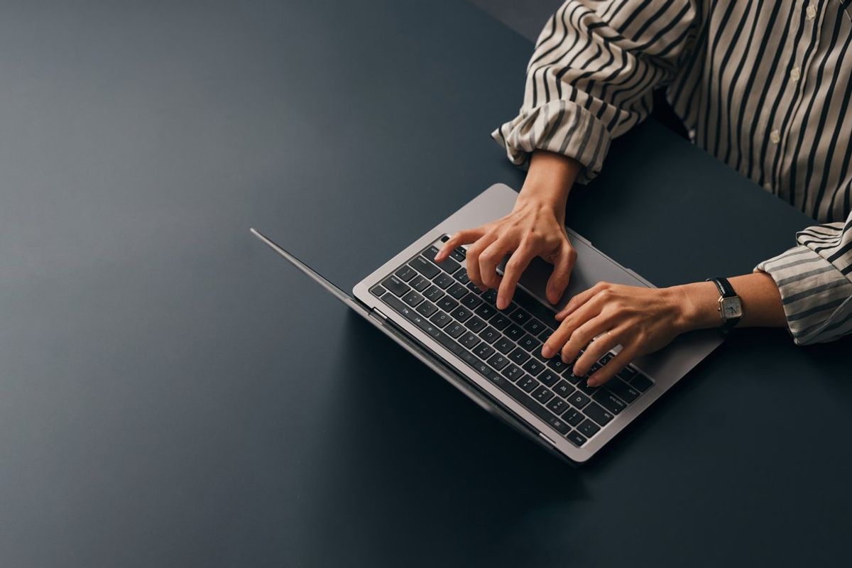 a person on a chromebook typing