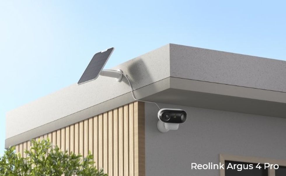 a photo of the Reolink Argus 4 Pro intalled on a buidlng outside.