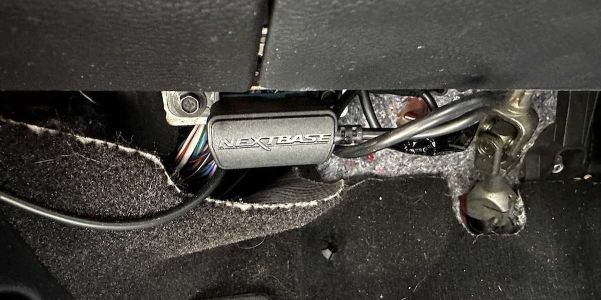 a photo of the Nextbase IQ inserted into the car's OBD port