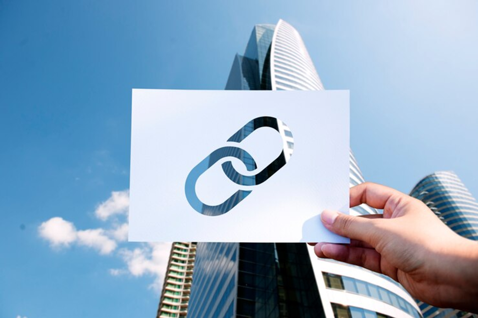 a photo of a office building with a card showing chain links