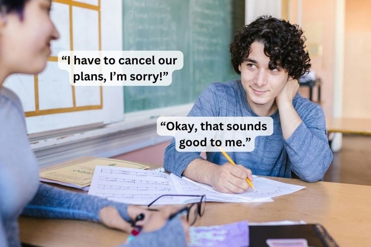 two people looking at each other over a desk
