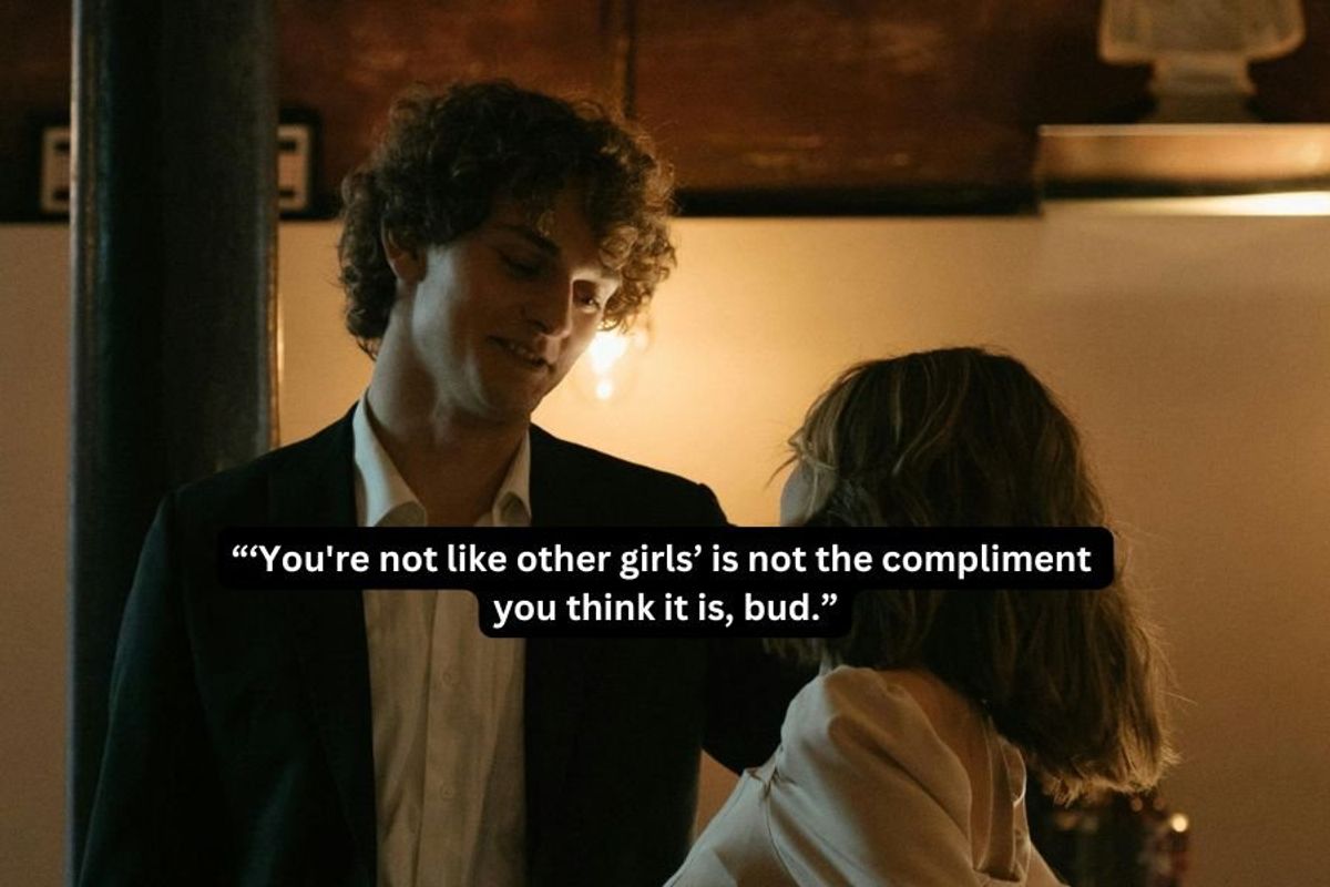 man talking to a woman in a dimly lit restaurant