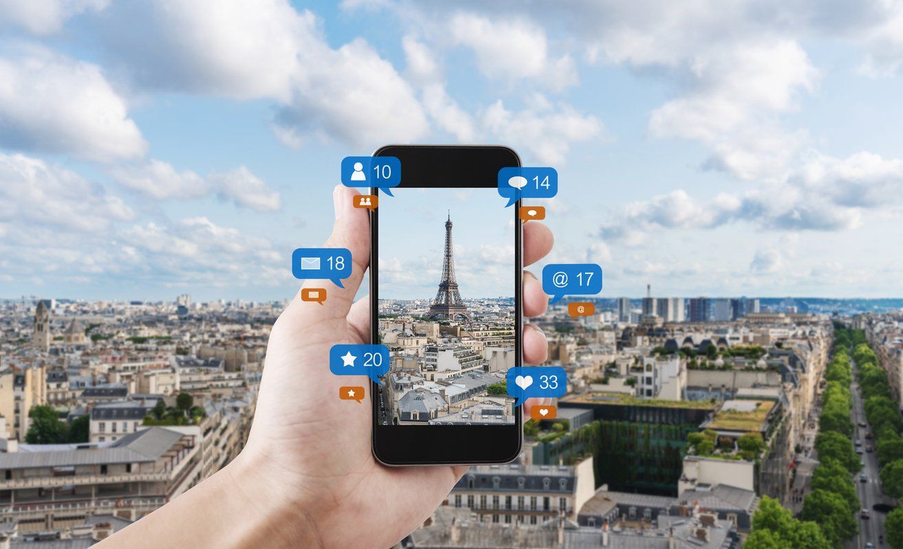 a smartphone showing Eifel Tower in Paris, France
