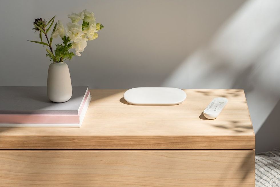 a photo of Google TV Streamer and smart home hub on a cradenza.