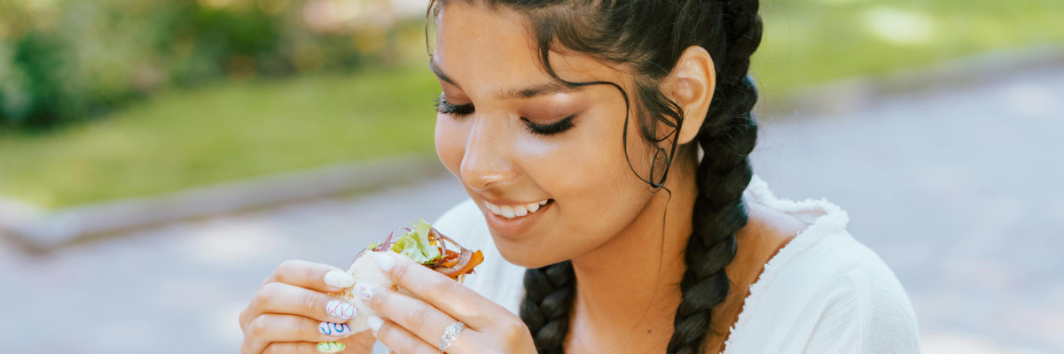 woman eating a taco