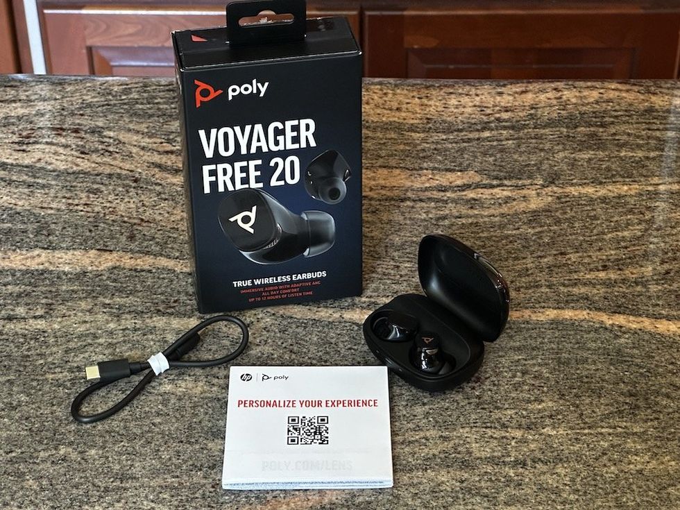 a photo of Poly Voyager Free 20 True Wireless Earbuds unboxed