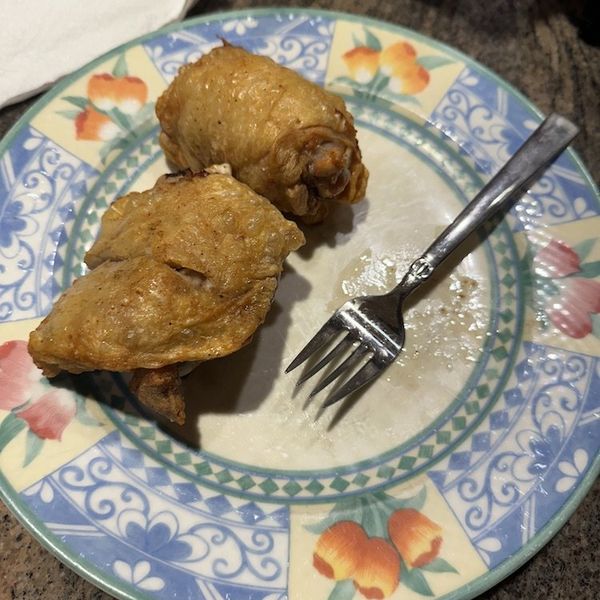 a photo of chicken cooked in Midea two-zone air fryer on a plate