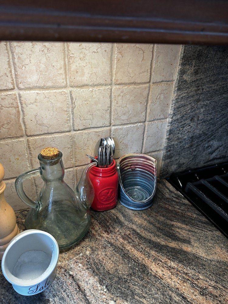 a photo of a countertop lit up with Cync reveal HD+ Smart Undercabinet Bar