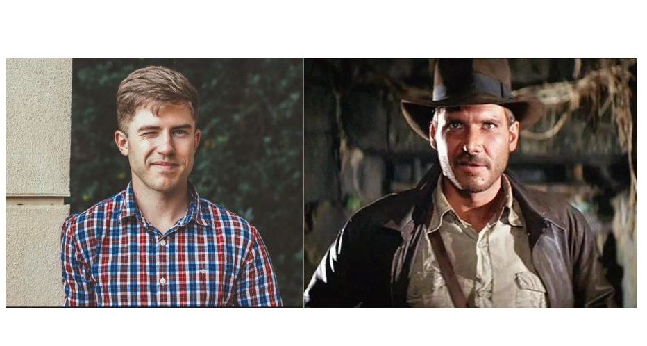 A man smarks next to a photo of Indiana Jones