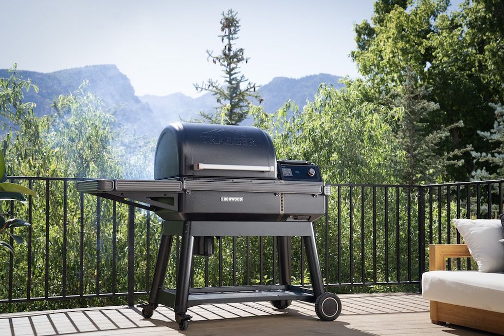 a photo of Traeger Woodridge GRill on a deck cooking