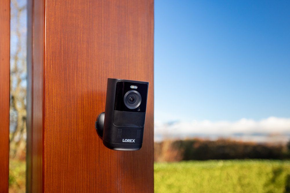 a photo of Lorex 4K Spotlight Battery Camera on a wall