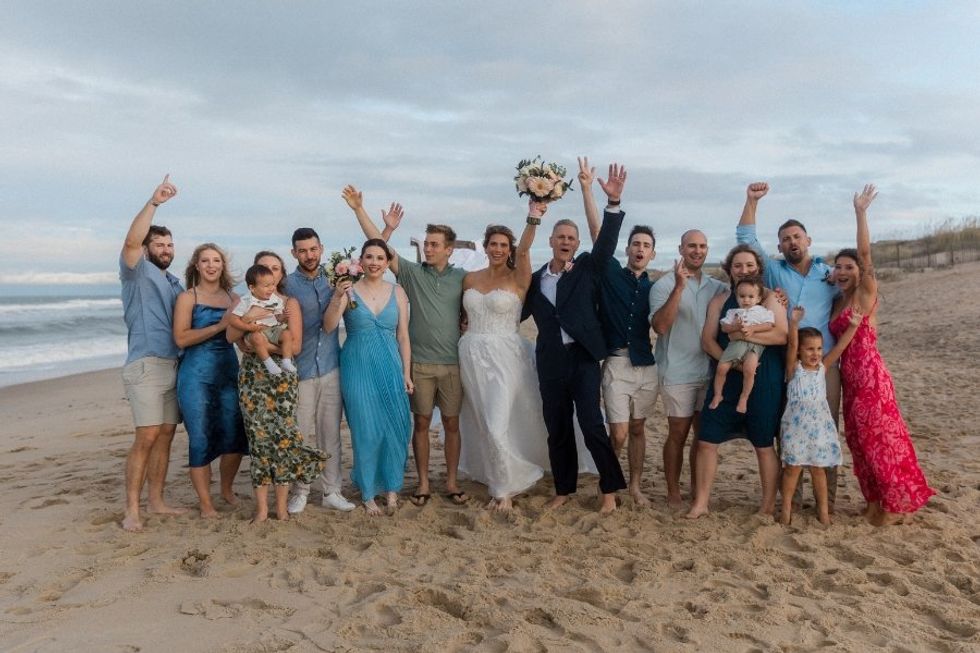 family at wedding on a beach