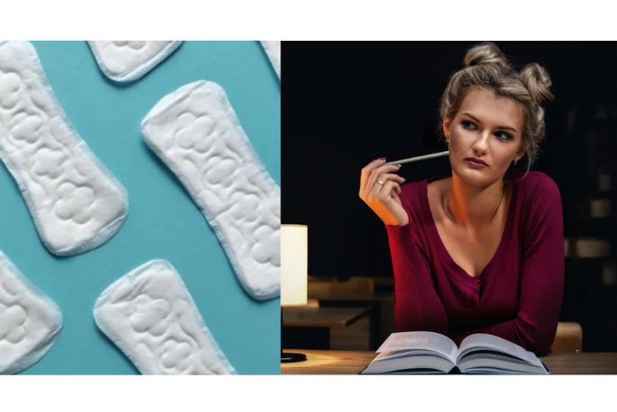 A teacher looks at an image of sanitary pads