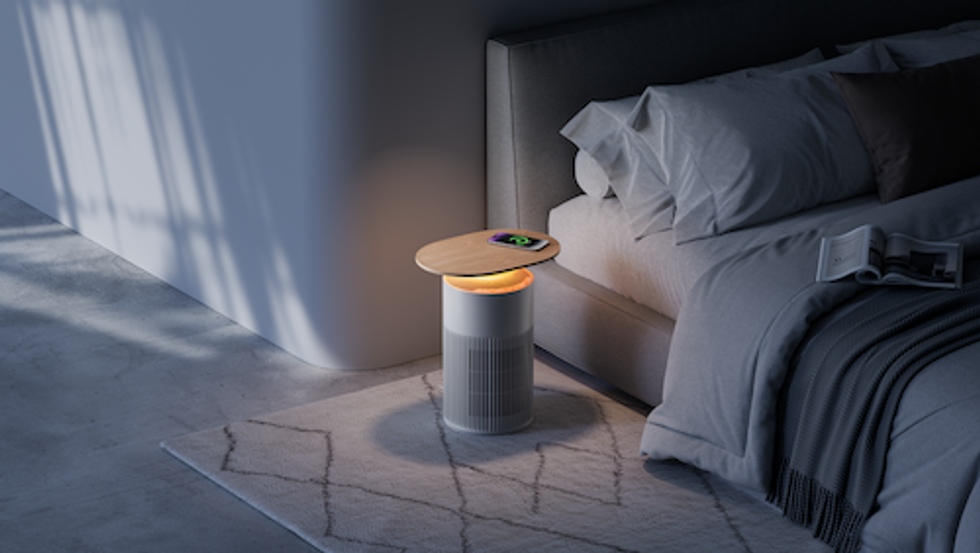 a photo of SwitchBot Air Purifier Table  in a bedroom with a smartphone on top charging