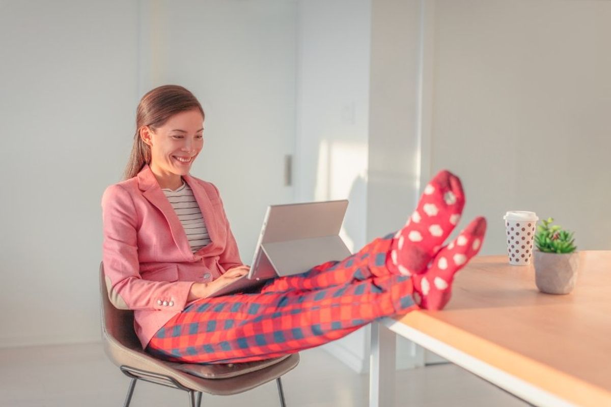 woman in suit jacket and pajama pants