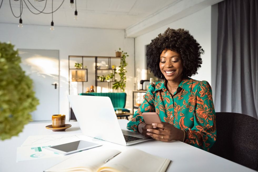 Beautiful woman working on laptop in an office stock photo