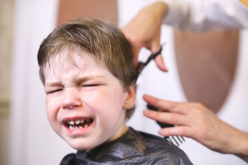 Barber finds calling walking neurodivergent children through haircuts free of charge