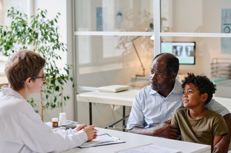 Father with child at the doctor