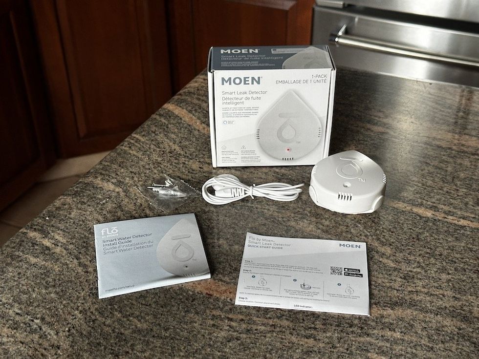 a photo of Moen Smart Leak Detector unboxed