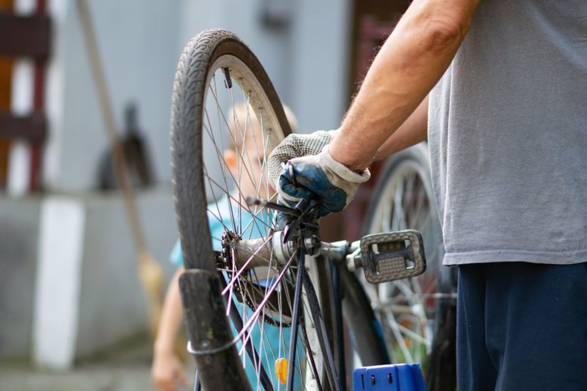 bike mechanic fixing a bike