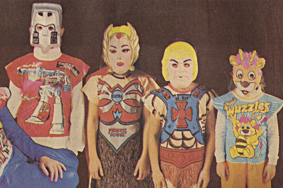 four kids in halloween costumes from the 80s
