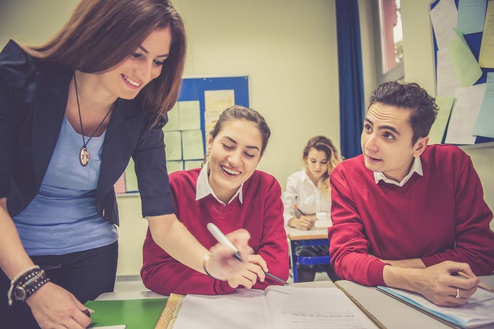 Happy Turkish Students and Teacher Working Together, School, Istanbul stock photo