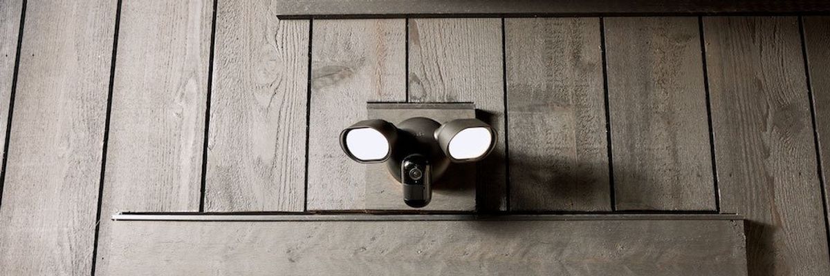 a photo of Arlo Wired Floodlight Camera above a window