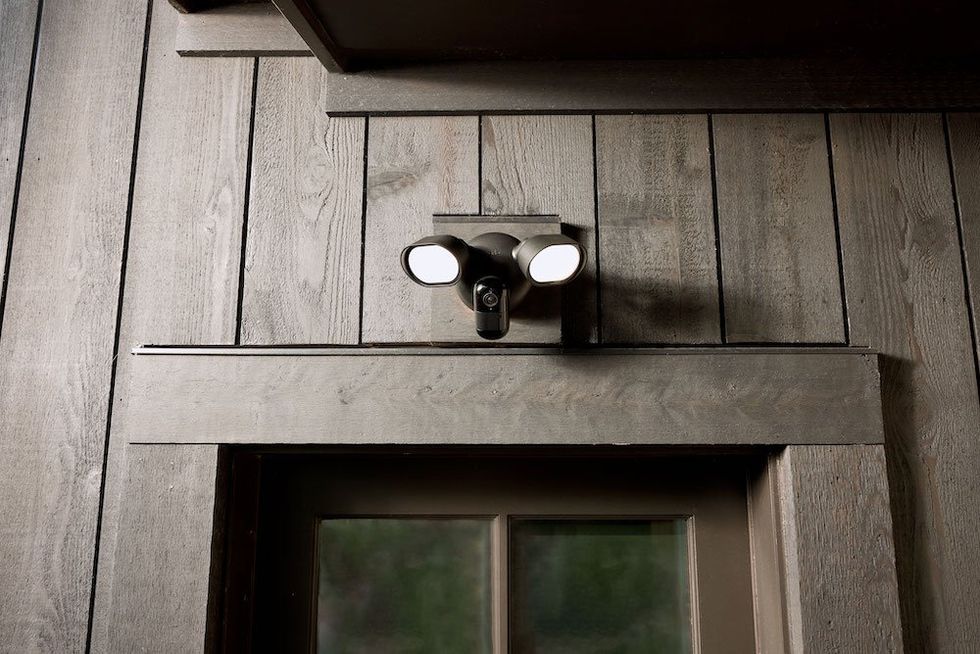 a photo of Arlo Wired Floodlight Camera above a window