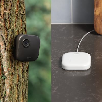 a photo of Blink Outdoor Camera 4 on a tree and new Blink Sync Module XR on a counter