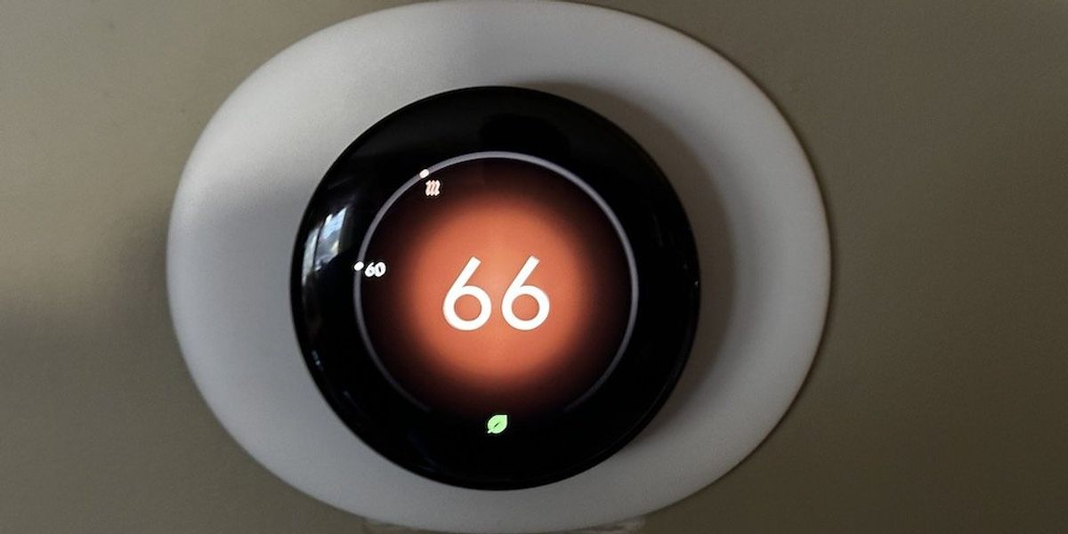 a photo of new Google Nest Learning Thermostat 4th Gen on a wall