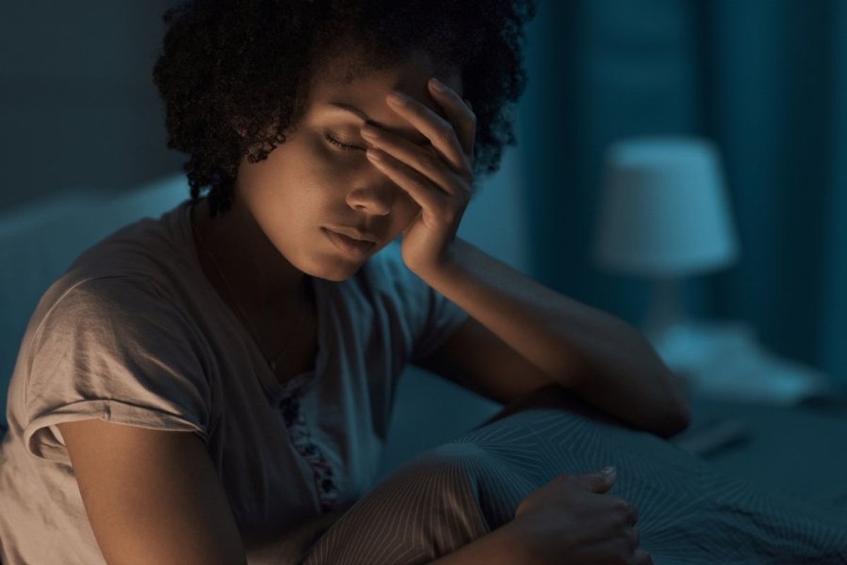 woman waking up at night groggy