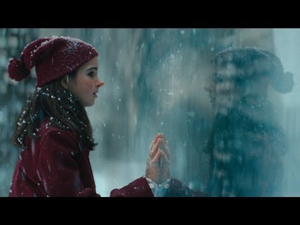 German holiday ad depicting two girls separated by invisible barriers hits home